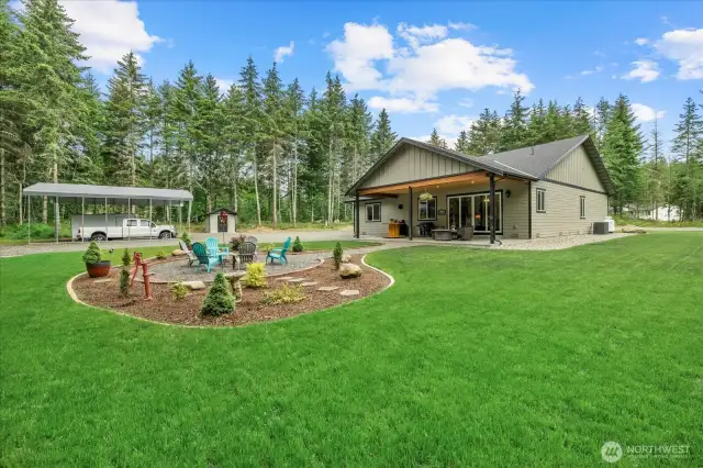 Imagine all your summer gatherings under the covered porch and next to the fire pit!  Do I smell the S'mores already?