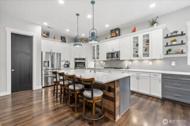 Open concept kitchen featuring walk in pantry and coffee bar.  All quartz countertops and thoughtful touches.