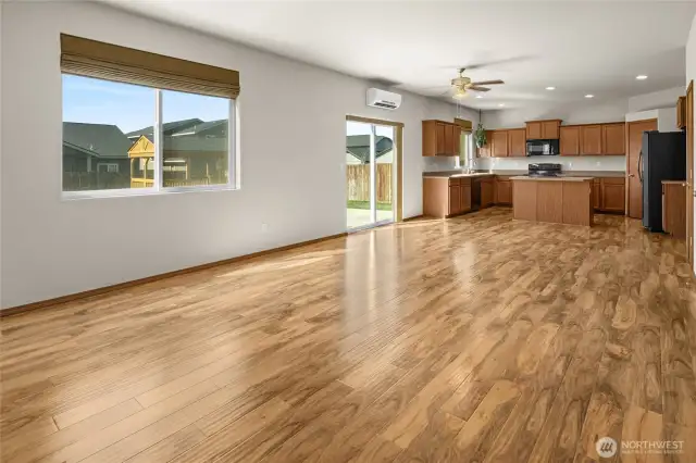 The main floor great room is open to the dining and kitchen