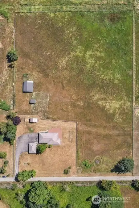 Aerial view of the 10 acer property witch produces its own hay.