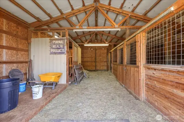 Inside barn with 2 stables, room for hay, storage and more.