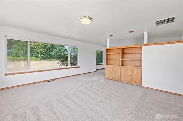 Family room with bookshelf and storage.