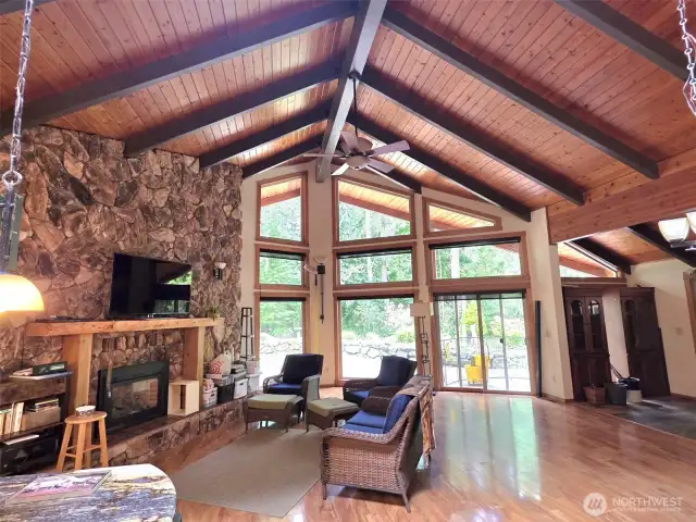 Open vaulting, tongue and groove ceilings with beams.    full rock fireplace