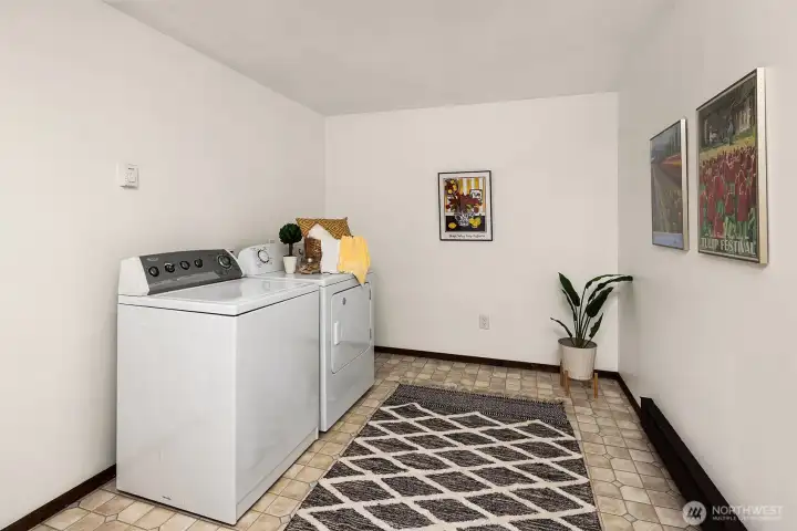 Spacious laundry with storage closet