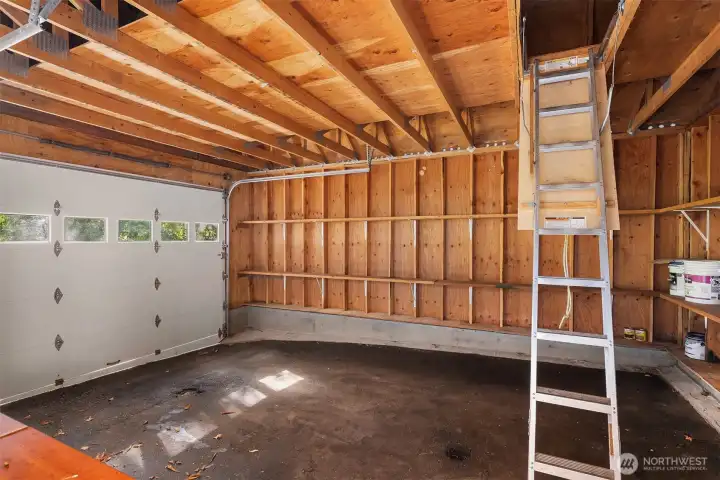 Garage with ladder storage area