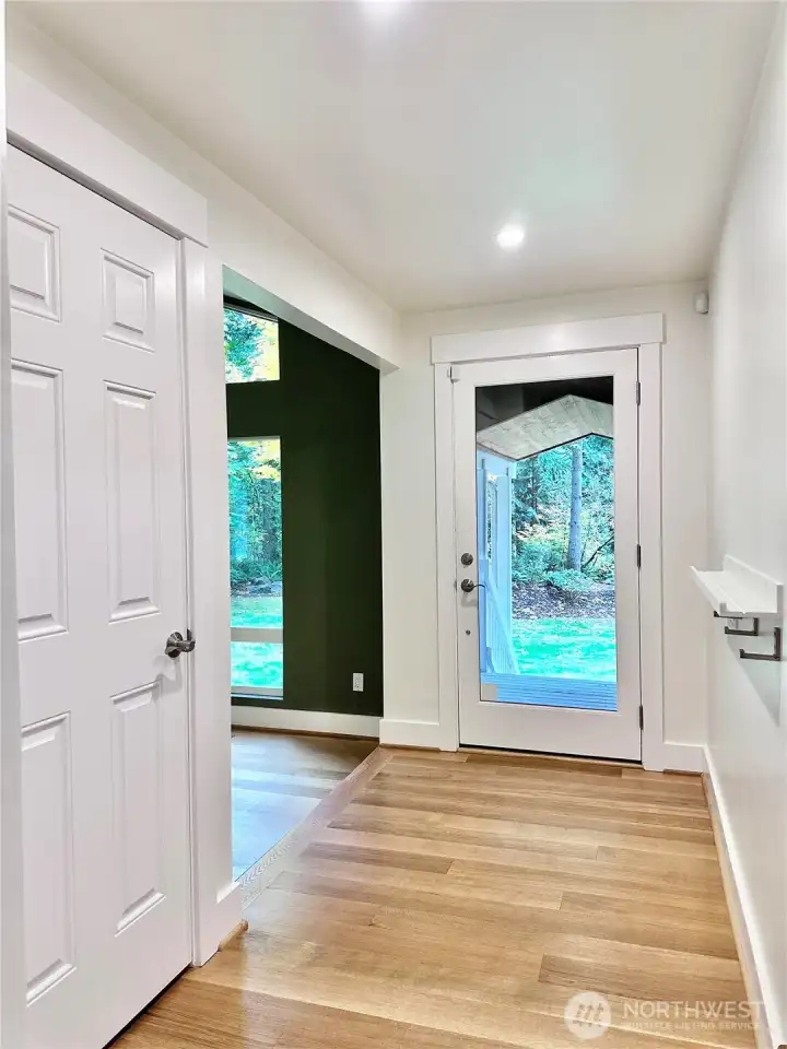 Light floods the entryway from the glass front door... another example of the thoughtful design of this elegant home.