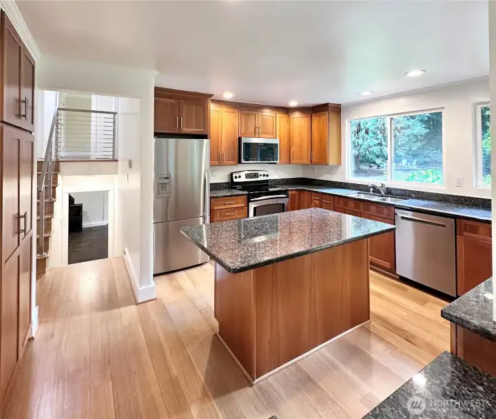 Enjoy the highly functional and efficient workspace designed for serious cooking, featuring SS appliances, ample granite countertops, and an abundance of storage.