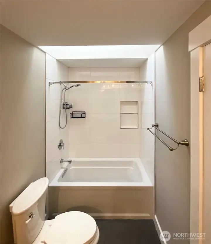 The main bath has a skylight so even this room is light filled! Clean clean clean...