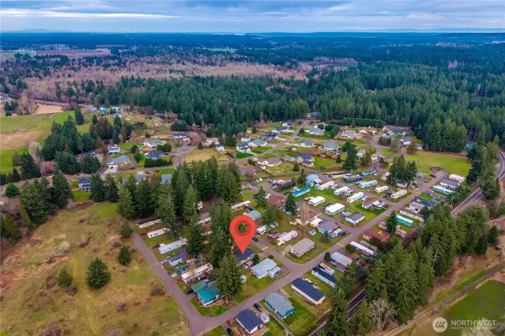 Aerial view showcases the surrounding neighborhood and the home’s convenient location within the community.