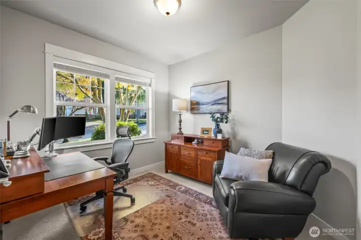 Main floor office in Horizon West home for sale in North Gig Harbor featuring large front-facing windows for natural light—ideal for remote work or study in this gated community near Downtown Gig Harbor and Hwy 16.