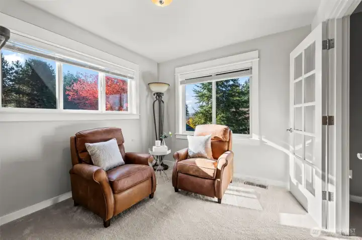 Sitting room inside the primary suite of Horizon West home for sale in North Gig Harbor, ideal for a private office, reading nook, nursery, or cozy lounge—offering flexibility and comfort within this spacious retreat.
