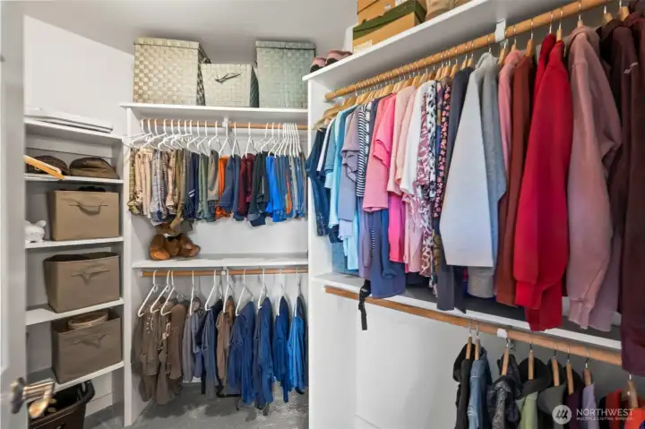 Walk-in closet in Horizon West home for sale in North Gig Harbor, accessible from the primary bathroom, offering ample shelving, hanging space, and organization for a spacious and functional master suite.