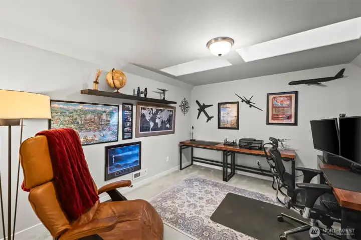 Upstairs office in Horizon West home for sale in North Gig Harbor featuring skylights and an open layout—bright, airy workspace ideal for remote work, crafts, or a creative studio.