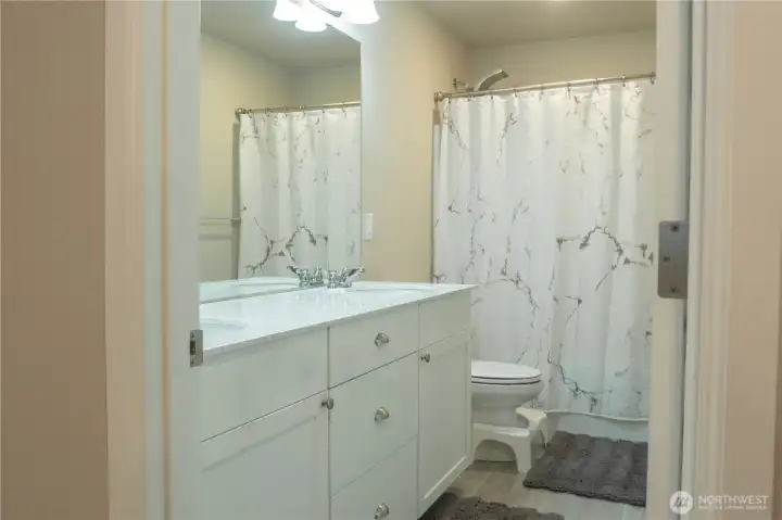 2nd level bathroom with double vanity sinks