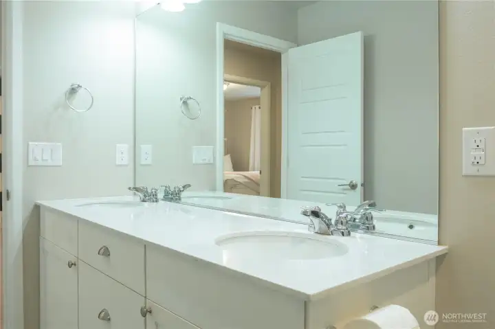 2nd level bathroom with double vanity sinks