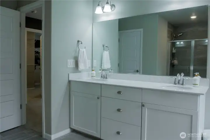 Primary bathroom with dual vanity sinks