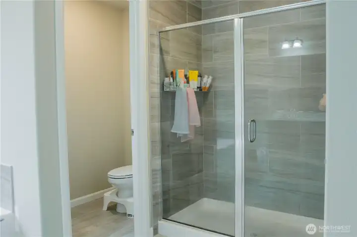 Primary bathroom with shower, and private toilet area