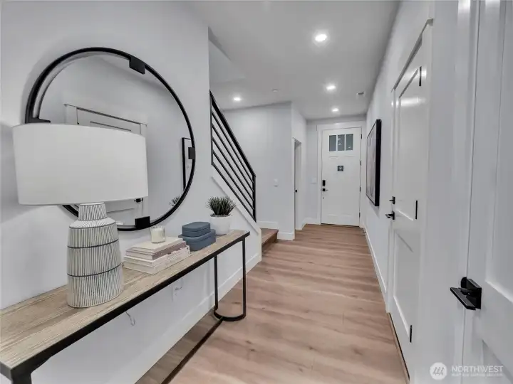 Inviting entry hall showcases 9' ceilings, which are incorporated on all levels.