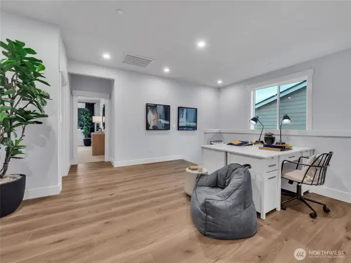 Light filled 2nd level loft provides flexible living space.