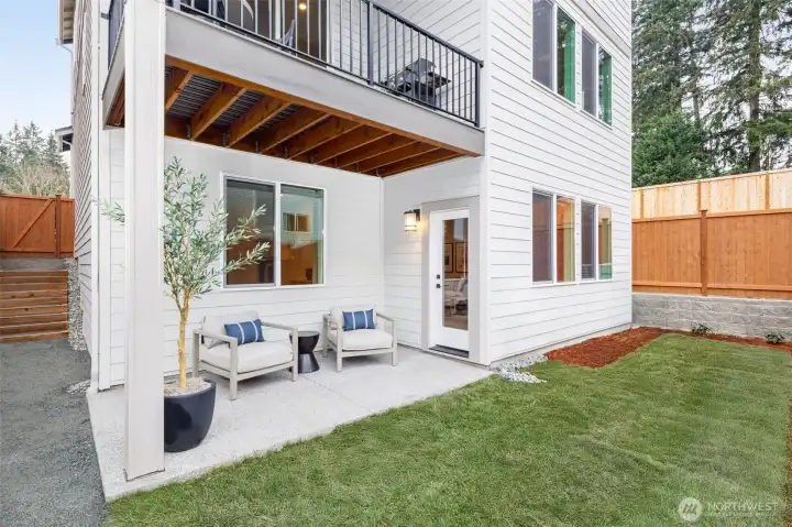 Relax on your covered rear patio overlooking the fully fenced/landscaped rear yard.