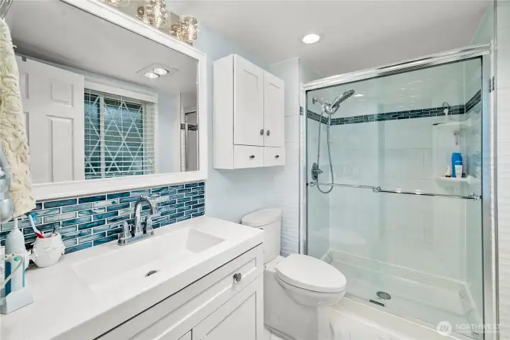 Primary bathroom with an updated spa like feel.