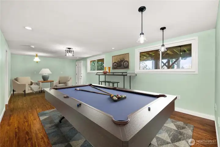 Featuring a spacious great room with a private entrance, this versatile space easily transforms into a premier mother-in-law suite or guest quarters. Seperate bedroom off this room with bathroom on lower level.