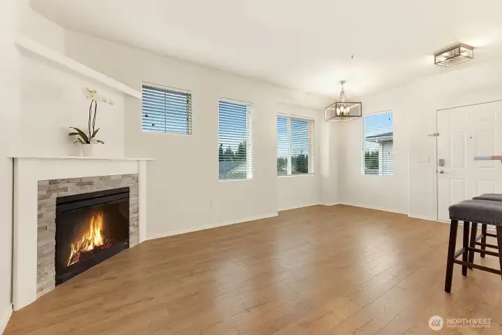 Welcome HOME!  Cozy fireplace, new engineered hardwood flooring, and large windows make you feel right at home.