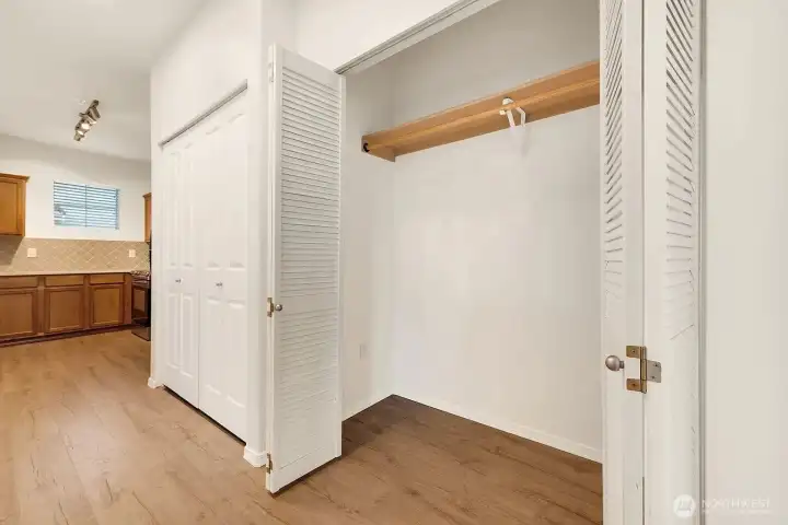 Large hallway closet with lots of storage.