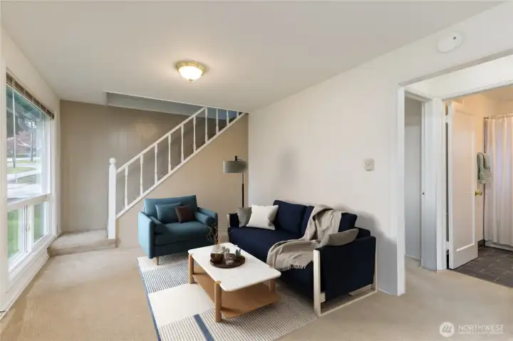Stairs lead to loft and upper bedroom