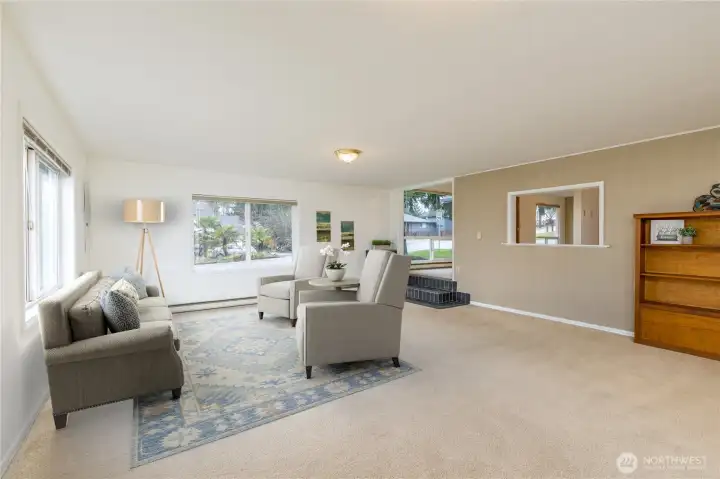 Large living room with big bright windows