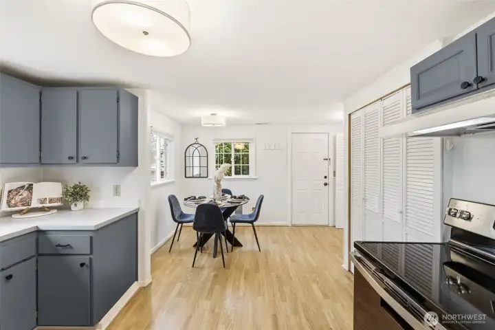 Open kitchen and dining with a door to the back yard