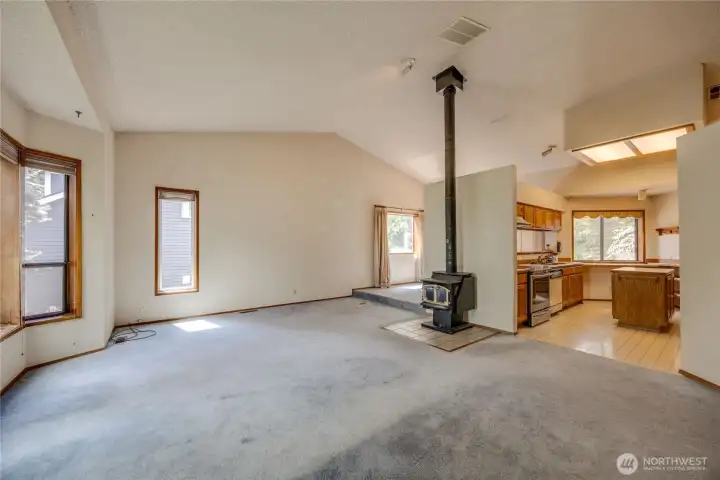 Another view the living room and wood burning stove.  Kitchen with all appliances stay