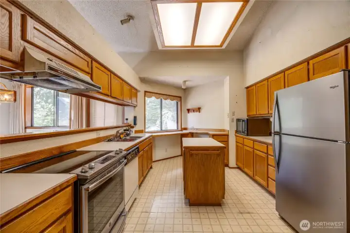 Large kitchen with view of the back yard