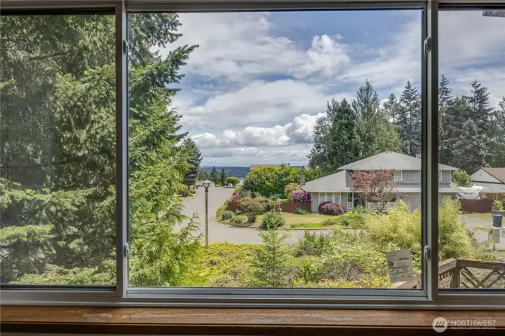 Peek a boo view of the water from the primary bedroom window
