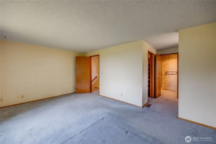 Another view of the primary bedroom showing