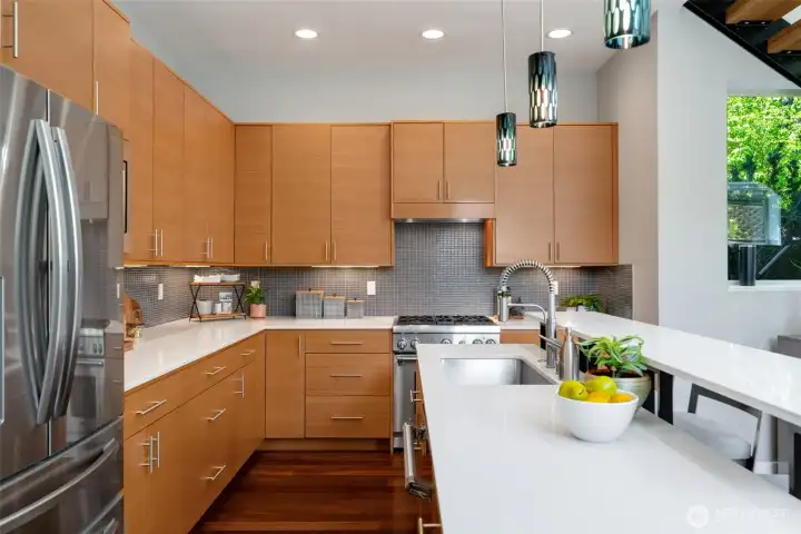 There is a walk-in pantry and striking blue tile backsplash There is a walk-in pantry and striking blue tile backsplash