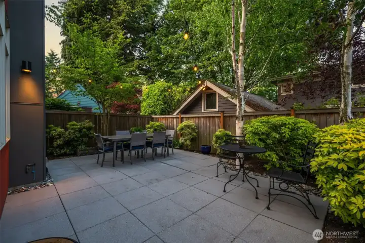 Lush landscaping surrounds the patio space Lush landscaping surrounds the patio space