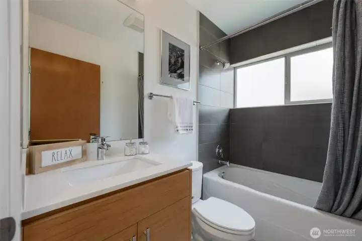 The three additional bright, well-sized bedrooms share a stylish full bath with quality tile and quartz finishes The three additional bright, well-sized bedrooms share a stylish full bath with quality tile and quartz finishes