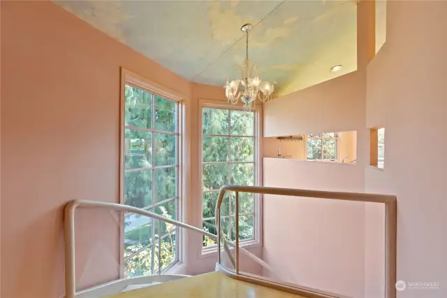 Huge windows grace the stairs from first to third floor for brilliant light throughout