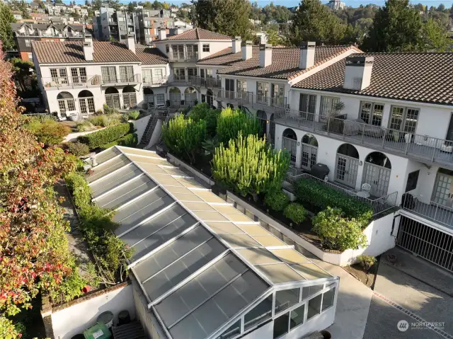 Gated garage access just to bottom right of photo