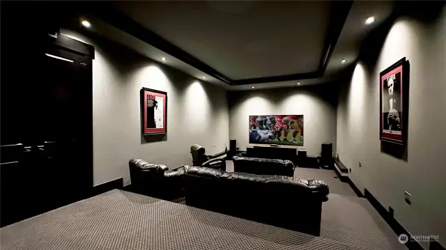 You will never have to leave home again with your own home theater ready for projector & wired for surround sound. Enjoy a wet bar in here too with customizable LED lights.