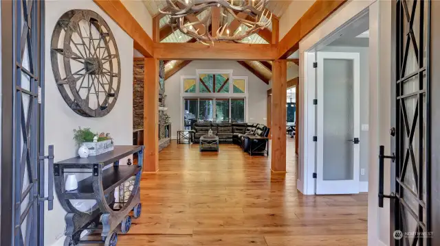 Enter to stunning engineered hardwoods, beautiful antler chandelier, exposed beams & open concept living in this expansive rambler.