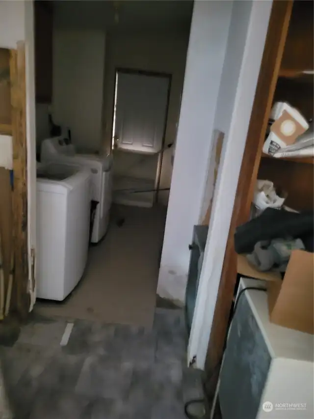 separate laundry room with door to the side deck