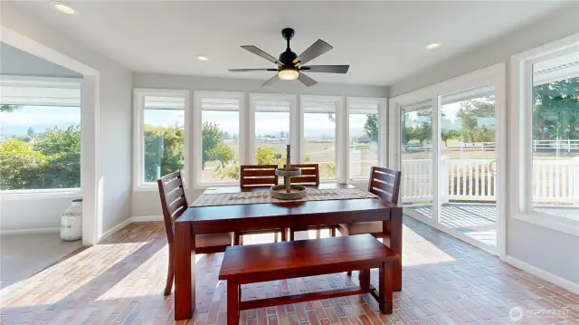 Bright and inviting dining space with panoramic views of the surrounding countryside
