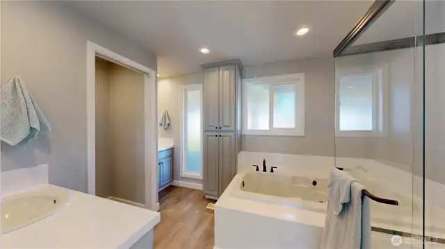 Primary bathroom with separate vanity area
