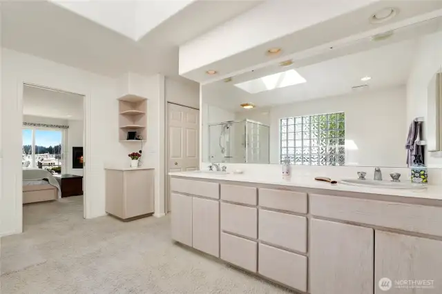 Spacious primary ensuite with plenty of natural light from the skylight, offers a roomy layout.