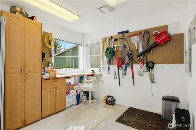 Shop area with a built-in desk, offering a productive workspace and stunning water views to inspire creativity.