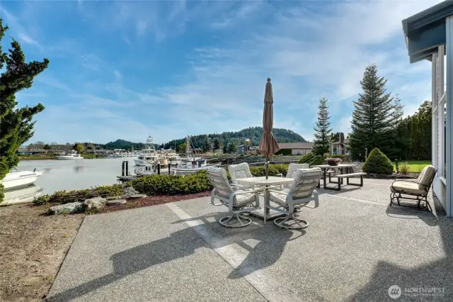 Expansive patio perfect for outdoor living, offering breathtaking water views and direct access to your shared dock.