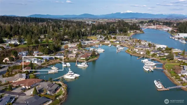 Stunning aerial view of this waterfront home, with the iconic Rainbow Bridge and majestic Mount Baker as the perfect backdrop.