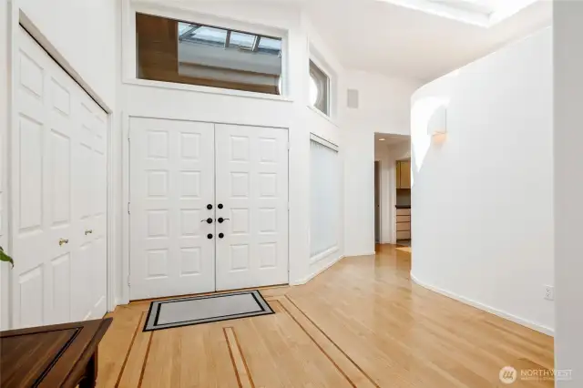 Bright and inviting, this light-filled entry sets the tone for the rest of the home, with warm natural light streaming in and creating a welcoming atmosphere.